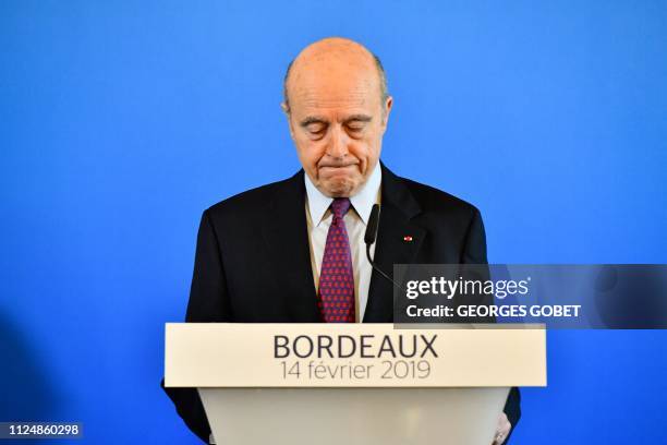 Outgoing Mayor of Bordeaux Alain Juppe reacts as he delivers a speech during a press conference in Bordeaux, on February 14, 2019 to announce the end...