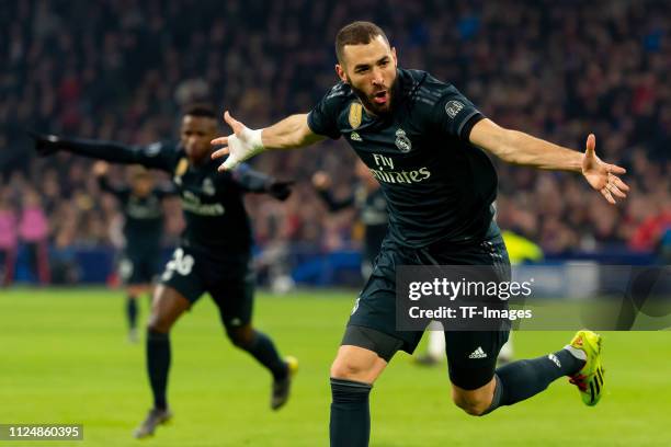 Karim Benzema of Real Madrid celebrates after scoring his team's first goal during the UEFA Champions League Round of 16 First Leg match between Ajax...