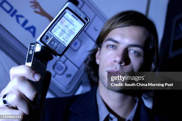 Press preview of new Nokia 6260 mobile phone. Shelter Restaurant, Causeway Bay. 5 October 2004.
