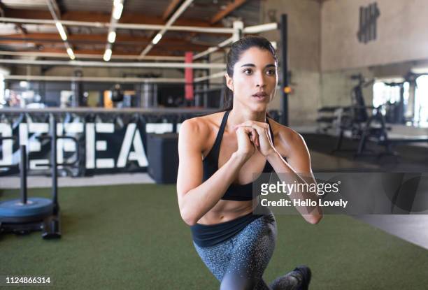 young woman training - forward athlete stockfoto's en -beelden