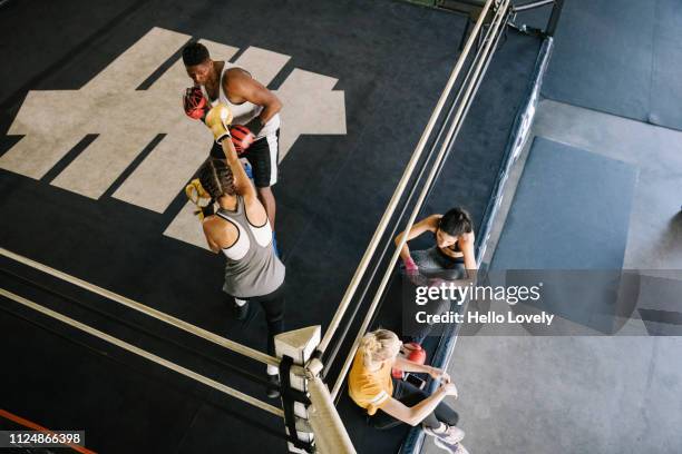 Athletes training at boxing gym