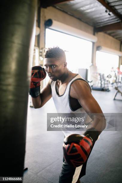 Boxer hitting punching bag