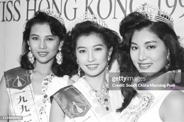 Miss Hong Kong Amy Kwok Oi-ming is flanked by first runner-up Valerie Chow Kar-ling and second runner-up Ada Choi Siu-fun during a photo session....