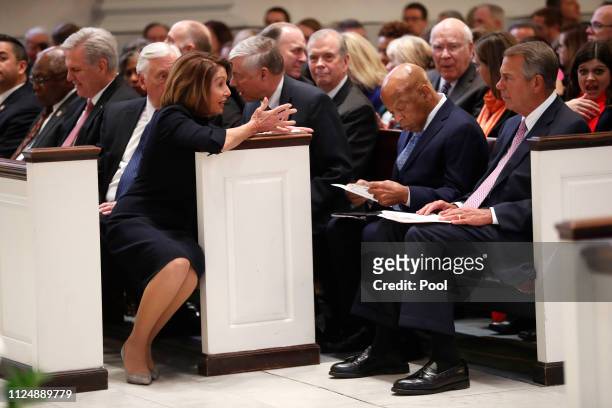 House Speaker Nancy Pelosi talks to former House Speaker John Boehner and Rep. John Lewis before a funeral service for former Rep. John Dingell on...