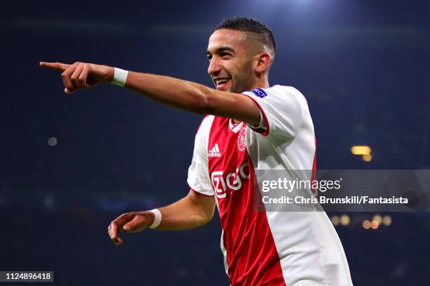 Hakim Ziyech of Ajax celebrates scoring his sides first goal during the UEFA Champions League Round of 16 First Leg match between Ajax and Real...