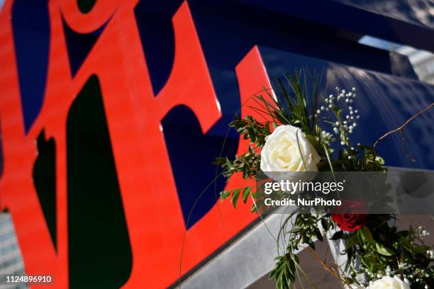 Bouquets of roses decorate the pedestal of the iconic LOVE Park statue, in Philadelphia, PA, on Valentines Day, February 14, 2019.