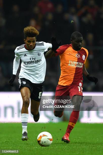 Benfica's Portuguese midfielder Gedson Fernandes fights for the ball with Galatasaray's Senegalese midfielder Papa Alioune Ndiaye during the UEFA...