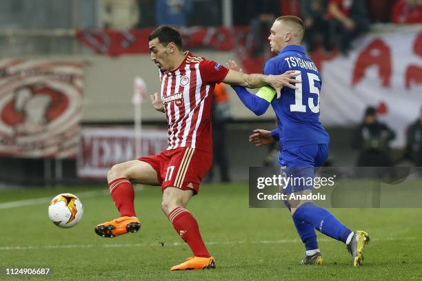 Lazaros Christodoulopoulos of Olympiacos in action against Viktor Tsygankov of Dynamo Kyiv during the UEFA Europa League Round of 32 match between...