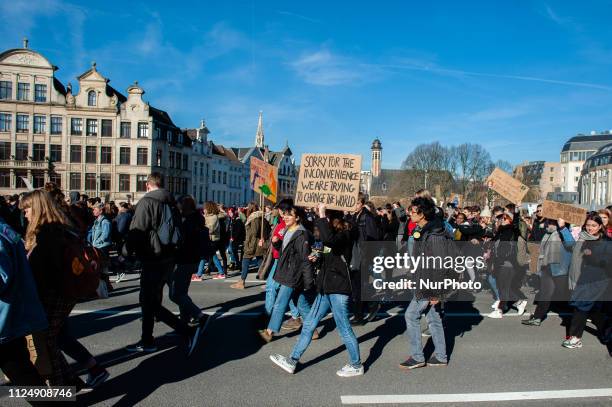 Group of Belgian students are holding placards and shouting slogans during the demonstration for better climate policy in Brussels, on February 14th,...