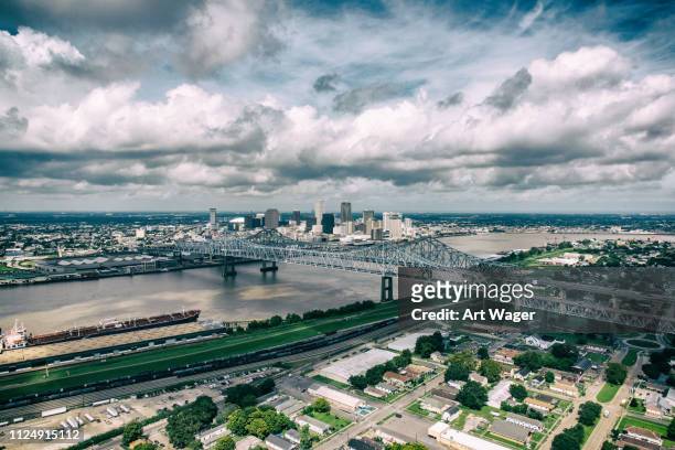 new orleans cityscape beyond the mississippi - gulf coast states photos stock pictures, royalty-free photos & images