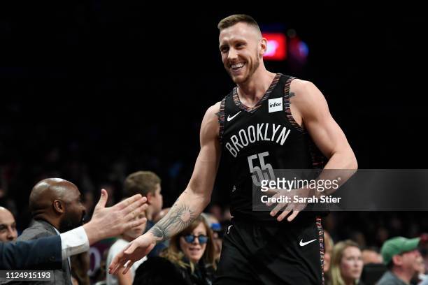 Mitchell Creek of the Brooklyn Nets high-fives the bench after taking free throws in place of injured Rondae Hollis-Jefferson during the fourth...