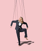 Businesswoman Controlled Like A Marionette