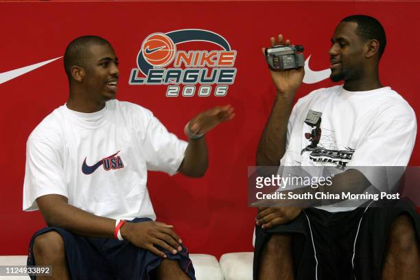 Star player swingman LeBron James of the Cleveland Cavaliers takes video footage of guard Chris Paul of New Orleans during a promotional stop in Hong...