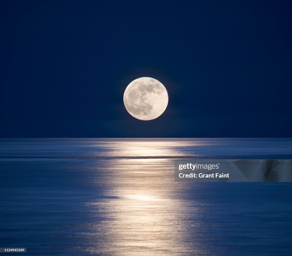 Moonrise over sea.