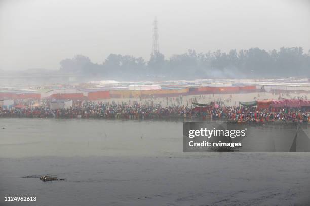 chhath festival celebrating during foggy day - chhath festival stock pictures, royalty-free photos & images