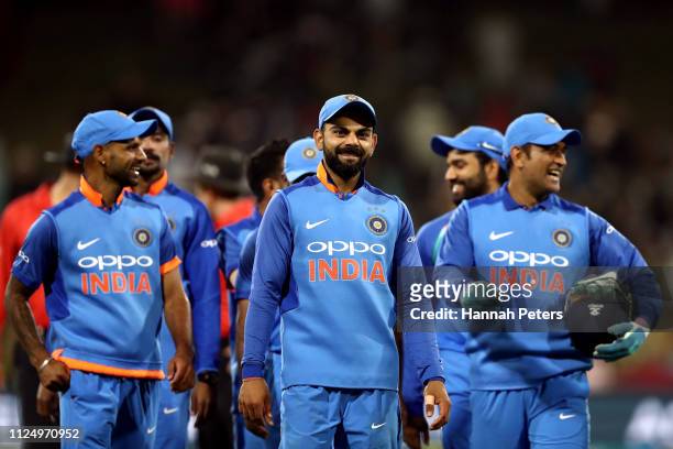Virat Kohli of India leads his team off after winning game two of the One Day International Series between New Zealand and India at Bay Oval on...