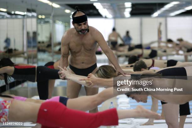 President Bikram Choudhury of Bikram's Yoga College of India teaching yoga at their centre in TST. 18 December 2006