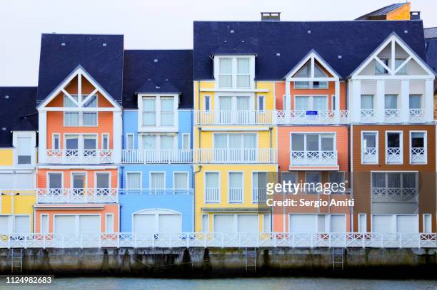 colourful painted houses on deauville beach - deauville beach stock pictures, royalty-free photos & images