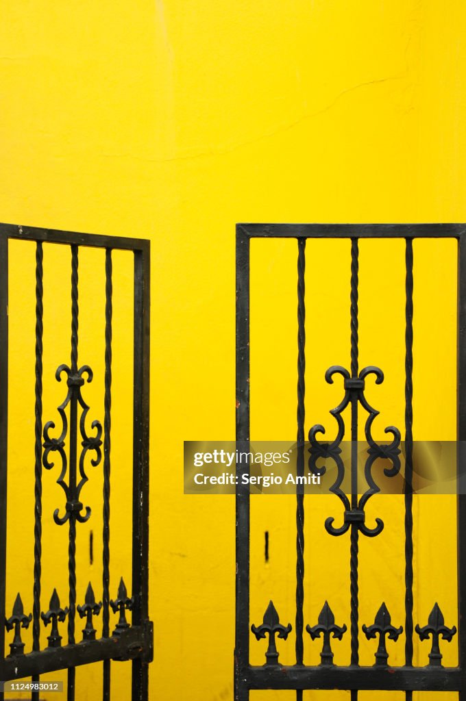 Gate on brightly coloured house in Cape Town