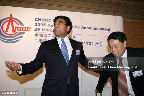 Fu Chengyu , Chairman & Chief Executive Officer of CNOOC Ltd.; with Zhou Shouwei, President and Executive Director of CNOOC Ltd; briefs to media on...