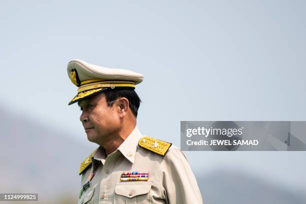 In this picture taken on February 14, 2019 Thai Prime Minister Prayut Chan-O-Cha reviews a guard of honour as he arrives to witness a disaster...