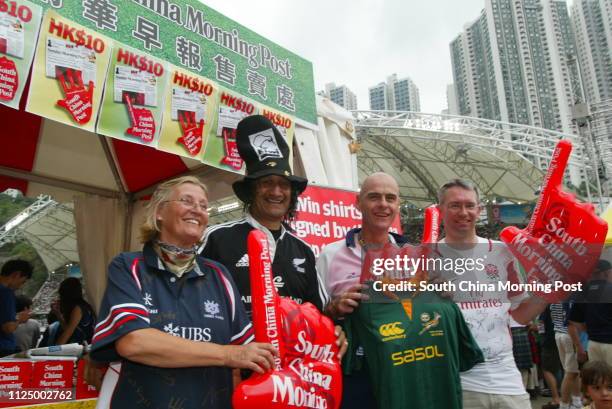 Winners of the official draw for jumpers pose at the Hong Kong Stadium on the final day of Rugby Sevens. 01 April 2007