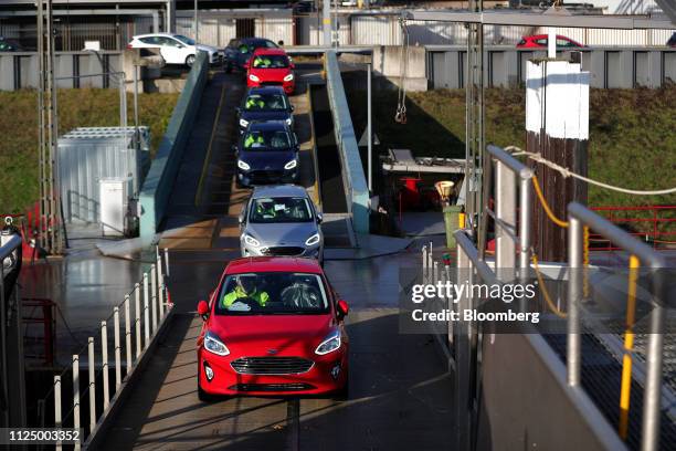 Line of new Ford Fiesta automobiles, manufactured by Ford Motor Co., are driven on board a barge before sailing to Vlissingen, Netherlands, on the...