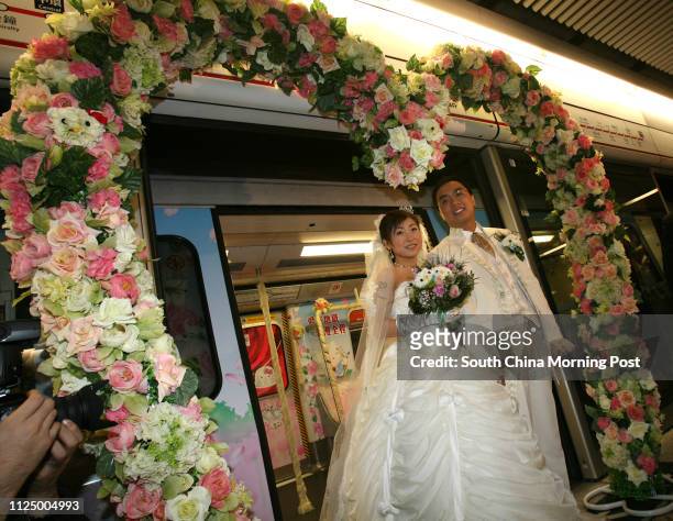 Bridegroom Jamie Ng Ho-yin and his bride Horlick Ho shuk-ling and their bridesmaids and groomsmen board the first-ever MTR Hello Kitty Wedding train...