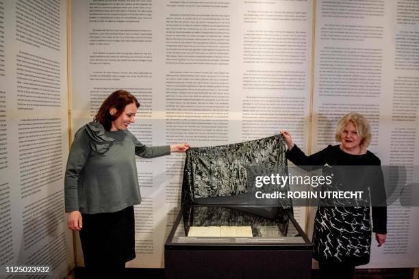 Irene Gerrits , collection director of the national archive of the Netherlands, and Janelle Moerman, director of the Prinsenhof museum unveil the Act...