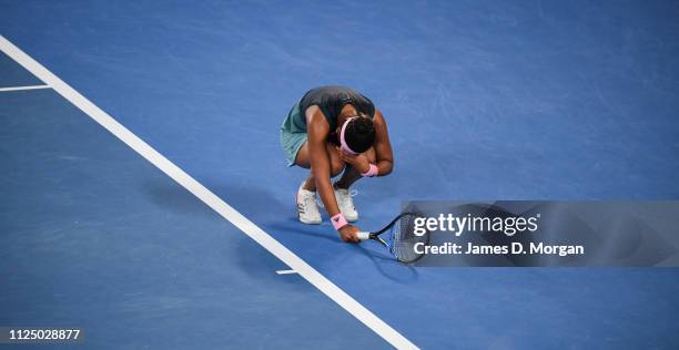 Naomi Osaka of Japan bends down on the baseline after hitting a bad shot during her Women's final match during day 13 of the 2019 Australian Open at...