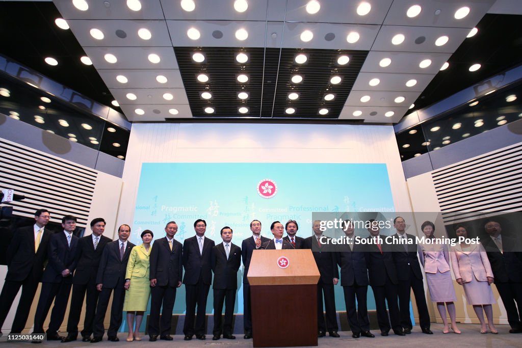 Chief Executive Donald Tsang Yam-kuen (Central) with his appointment of Principal Officials under the Accountability System for the third term of the HKSAR Government meet the media at the Central Government Offices, Central. (L-R) Norman Chan Tak-Lam, S