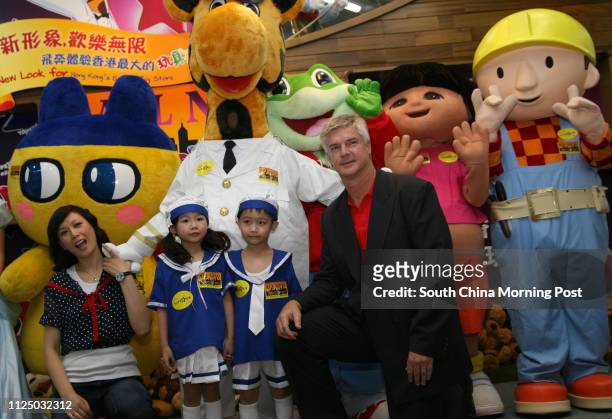 Model Qi Qi and Pieter Schats , chief executive officer of Toys Li Fung Ltd, officiate the opening ceremony of Toys 'R' Us in Ocean Terminal. 11 July...