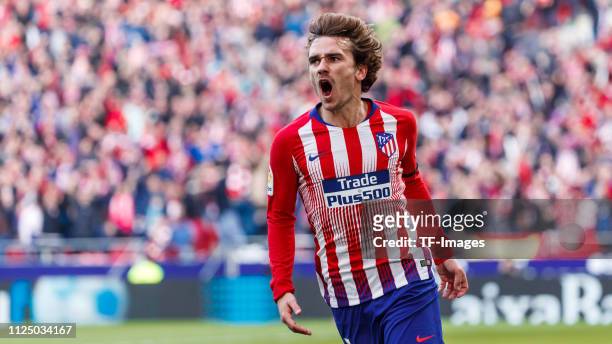 Antoine Griezmann of Atletico de Madrid celebrates after scoring his team`s first goal 1:1 battle for the ball during La Liga match between Atletico...