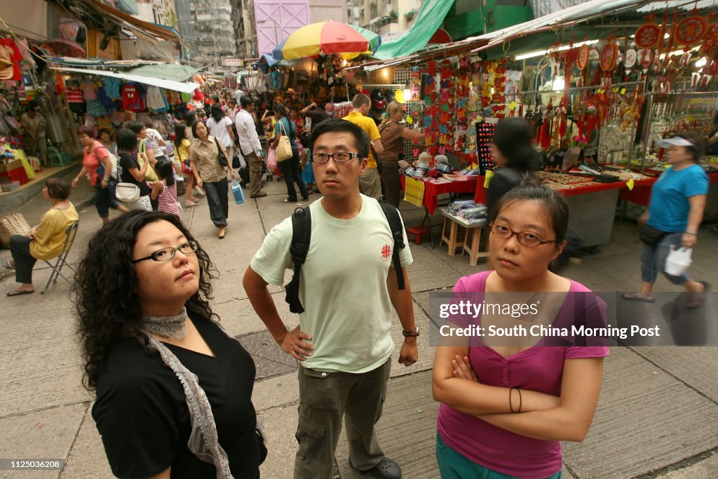 Three young artist (from left to right) Tang Siu-wah, Au Yeung Tung and Chan Ka-yuen, who involve in the movement of protecting HK cultural hertiage, pictured in Wan Chai. 23 August 2007