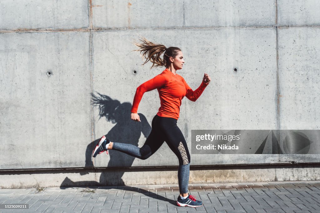 Woman running outdoors in the city