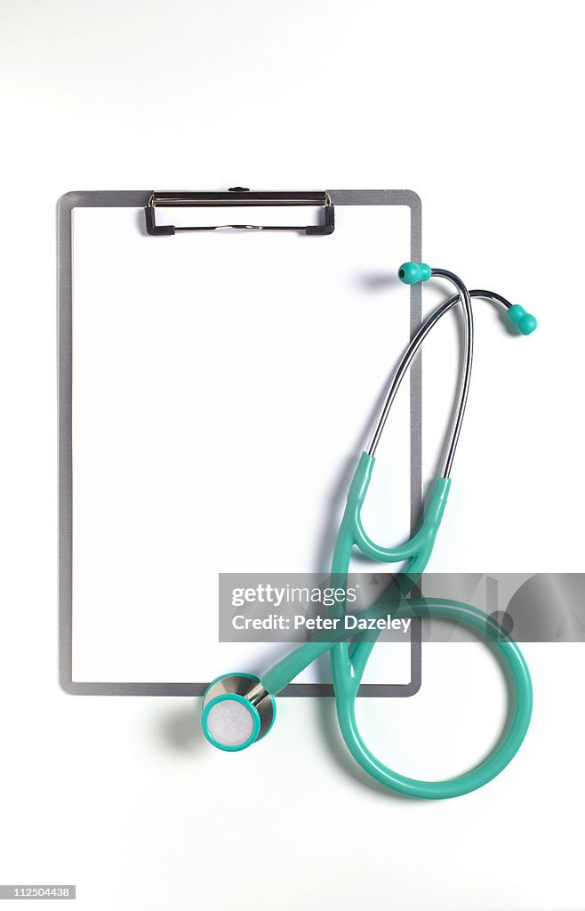Stethoscope and clipboard with copy space