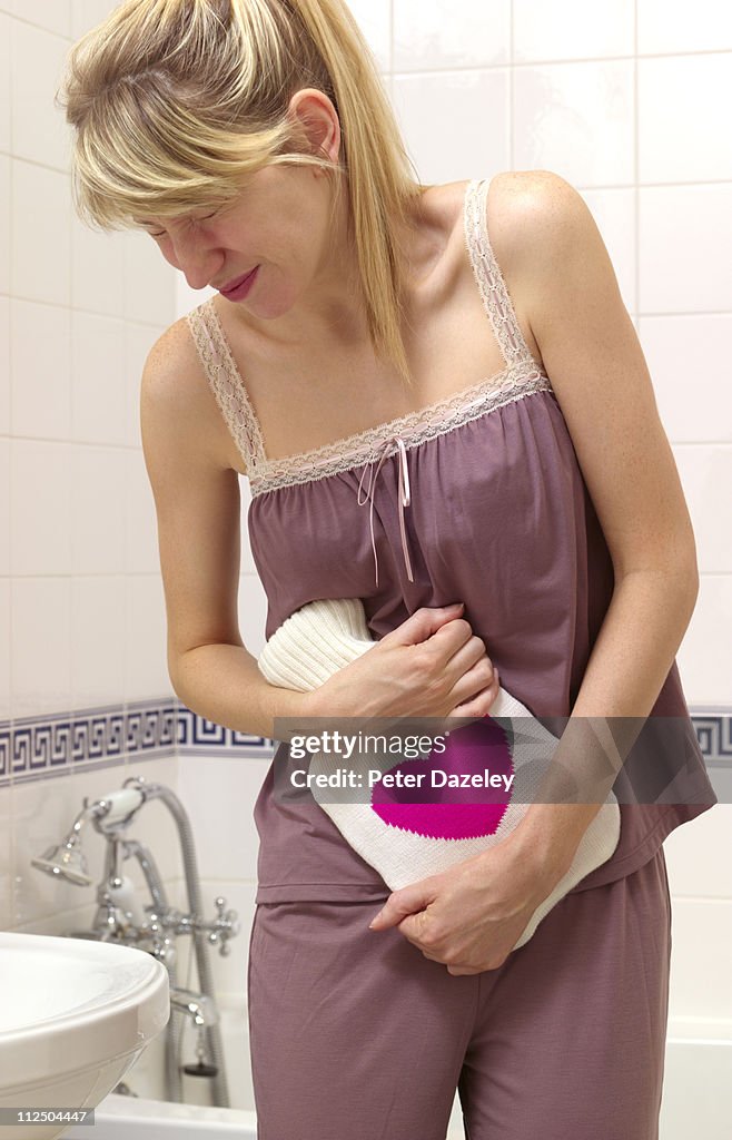 Young woman with stomach pains