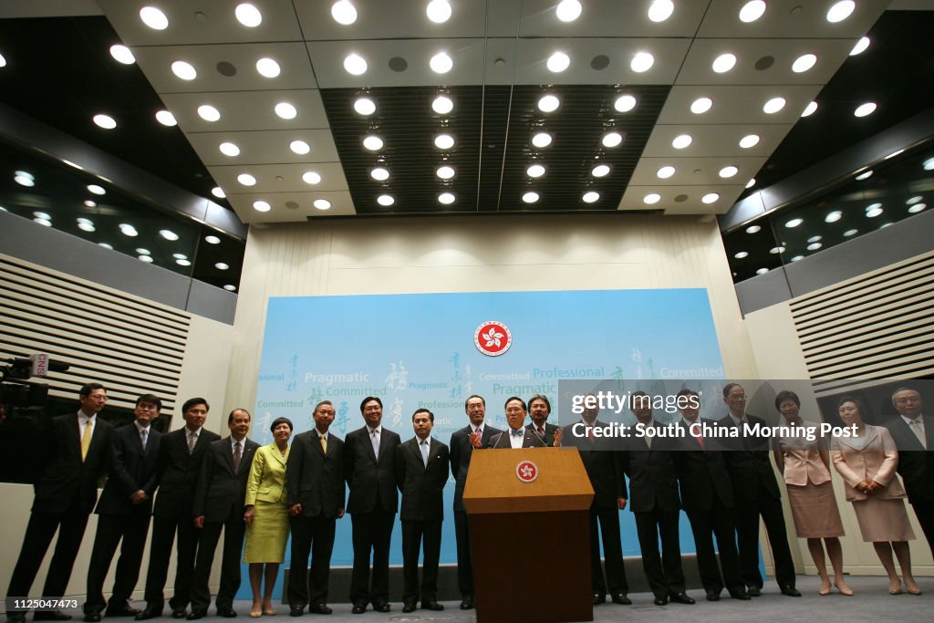 Chief Executive Donald Tsang Yam-kuen (Central) with his appointment of Principal Officials under the Accountability System for the third term of the HKSAR Government meet the media at the Central Government Offices, Central. (L-R) Norman Chan Tak-lam, Se