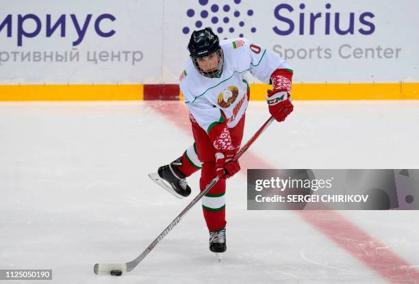 Nikolai Lukashenko , son of Belarus President Alexander Lukashenko, takes part in an ice hockey match with his father and the Russian president at...