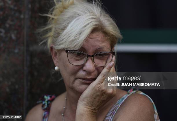 Mirta Taffarel aunt of late footballer Emiliano Sala, reacts as the van carrying the coffin with the remains of her nephew arrives in Santa Fe...