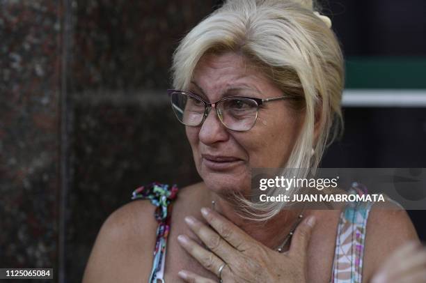 Mirta Taffarel aunt of late footballer Emiliano Sala, reacts as the van carrying the coffin with the remains of her nephew arrives in Santa Fe...