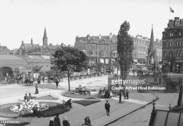 The station square with the monument and gardens in Harrogate, a Yorkshire spa town, 1913.