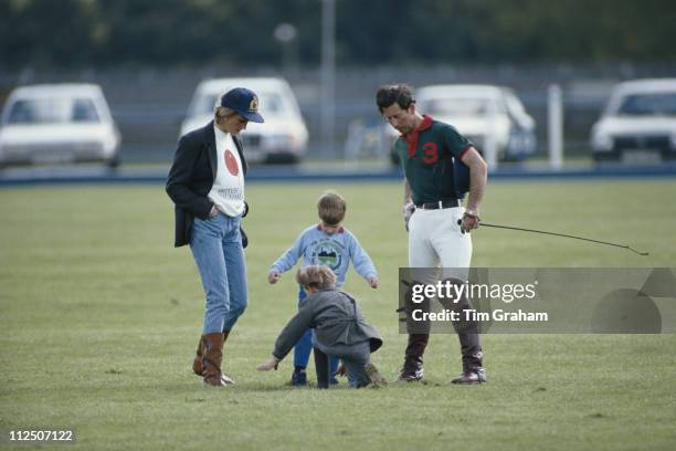 Diana, Princess of Wales with Prince Charles and their two sons, Prince William and Prince Harry, together attending a polo match at the Guards Polo...