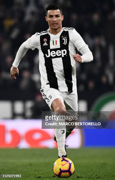 Juventus' Portuguese forward Cristiano Ronaldo runs with the ball during the Italian Serie A football match Juventus vs Frosinone on February 15,...