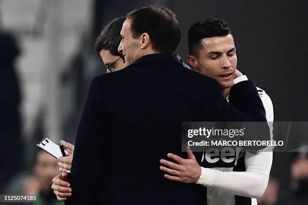 Juventus' Portuguese forward Cristiano Ronaldo embraces Juventus' Italian coach Massimiliano Allegri after being substituted during the Italian Serie...