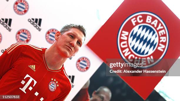 Bastian Schweinsteiger poses in the new FC Bayern Muenchen home jersey for the season 2011/12 at Allianz Arena on April 19, 2011 in Munich, Germany.