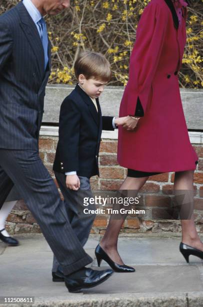 Prince William is led by his mother, Diana, Princess of Wales , alongside his father, Prince Charles, as they attend an Easter service at St George's...