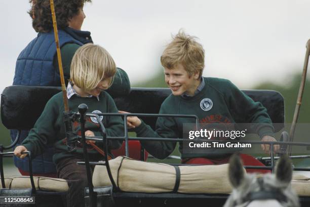 Zara Phillips and her brother Peter Phillips riding a carriage at the Royal Windsor Horse Show, held at Home Park in Windsor, Berkshire, England,...