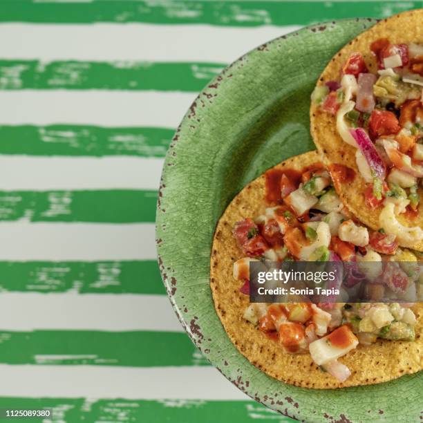 closeup of  two ceviche tostadas - tostada stock pictures, royalty-free photos & images