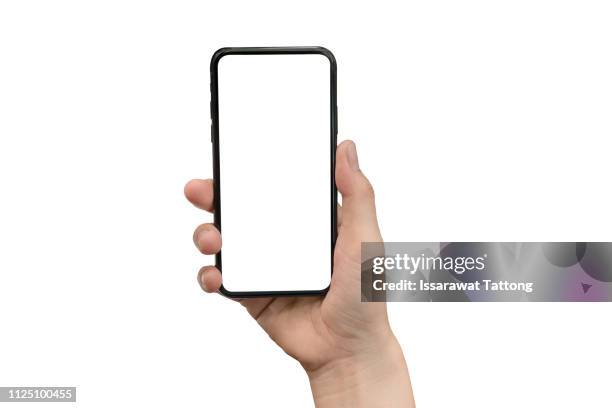 close up hand hold phone isolated on white, mock-up smartphone white color blank screen - specimen holder stockfoto's en -beelden